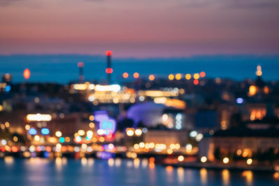 Defocused image of illuminated city at night