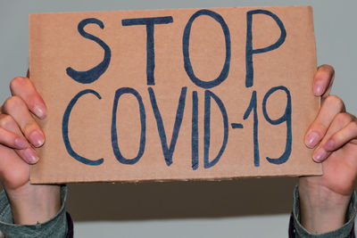 Close-up of hand holding text