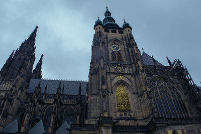 Low angle view of cathedral against cloudy sky