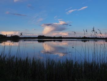 Scenic view of lake against sky during sunset