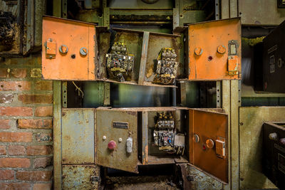 Close-up of machine part of abandoned factory