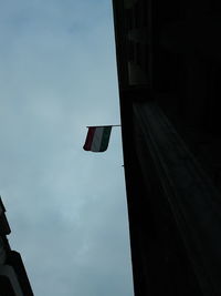 Low angle view of flag against sky