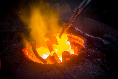 Close-up of fire burning at night