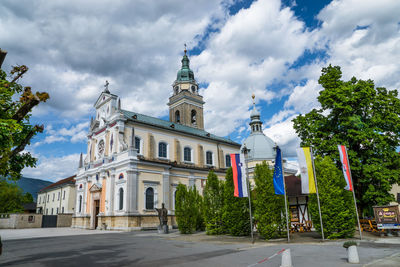 Buildings against cloudy sky