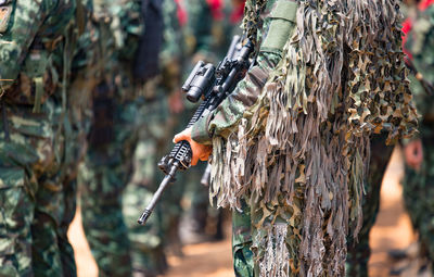 Soldiers with weapons on military combat training