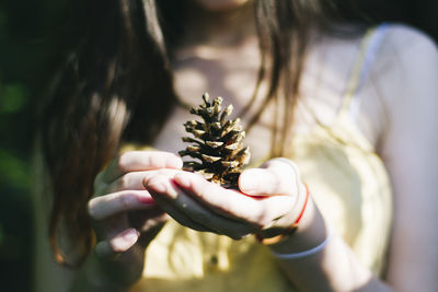 Close-up of woman holding flowers