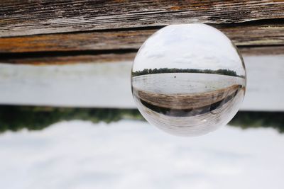 Close-up of crystal ball on glass