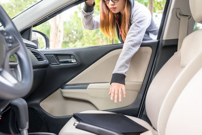 Woman sitting in car