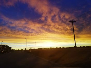 Scenic view of beach against sky during sunset