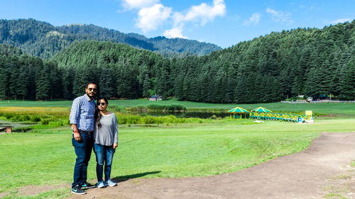 Portrait of couple standing on land