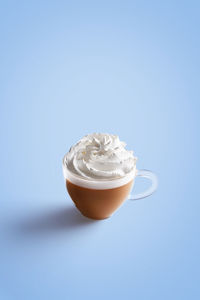 Close-up of coffee cup against white background