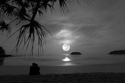 Scenic view of sea against sky at night