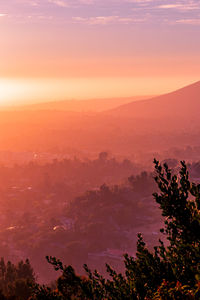 Scenic view of silhouette landscape against sky at sunset