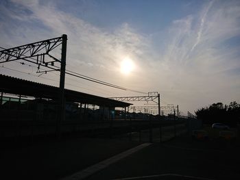 Silhouette bridge against sky during sunset