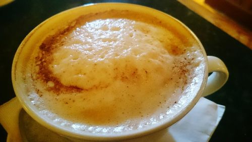 Close-up of coffee cup on table