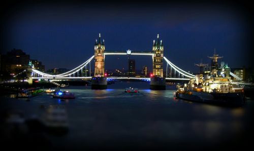 Bridge over river at night