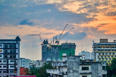 Buildings against sky during sunset