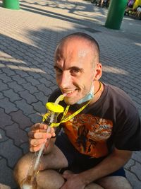 Portrait of man sitting outdoors