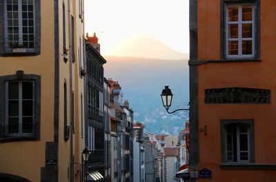 Buildings in city at sunset