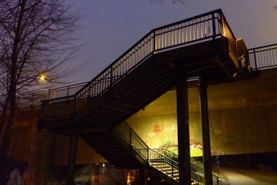 Low angle view of bridge against sky at night