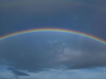 Low angle view of rainbow against sky