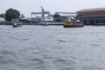 Boats moored at harbor