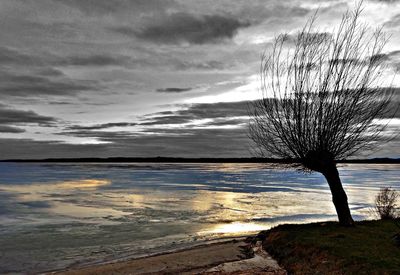 Scenic view of sea against cloudy sky