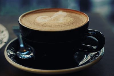 Close-up of coffee cup on table