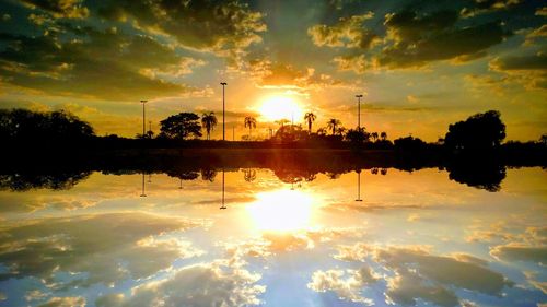 Scenic view of lake against sky during sunset