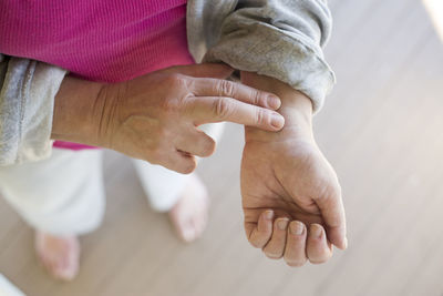 Close-up of couple holding hands