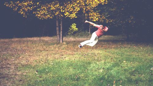 Man jumping on grassy field
