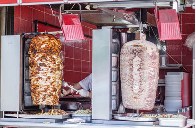 Chef cooking shawarma in shop