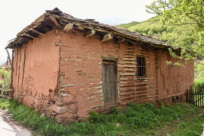 Exterior of house on field against sky