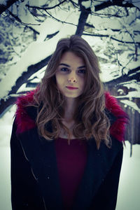 Portrait of young woman in snow