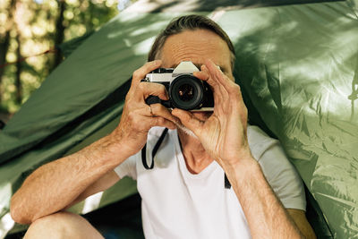 Man photographing with camera
