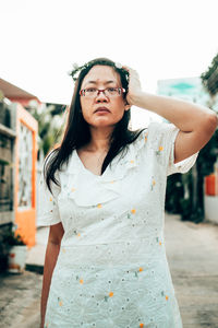 Portrait of woman standing outdoors