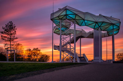 Low angle view of bridge against sky at sunset