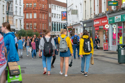 Group of people walking on city street