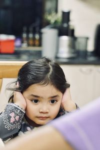 Portrait of cute girl at home