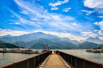 Scenic view of lake against cloudy sky