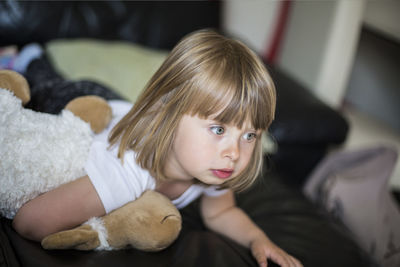 Girl lying on sofa at home