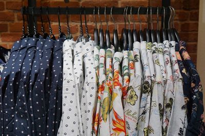 Clothes hanging in rack at store