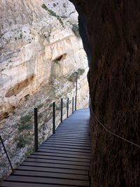 Narrow footpath leading towards rock formation