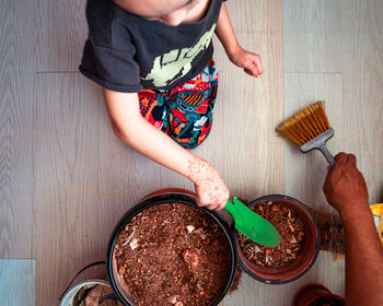 High angle view of boy preparing food
