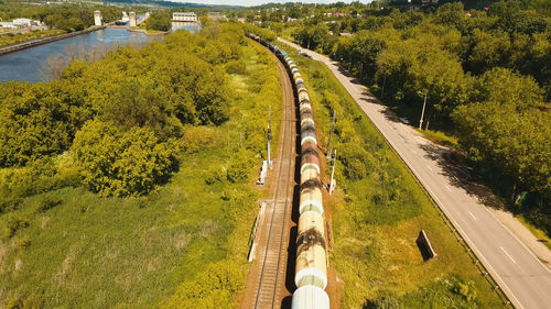 Freight train with cisterns and containers on the railway. aerial view container freight train