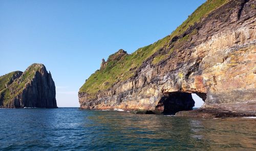 Scenic view of sea against clear blue sky