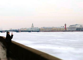 People in front of sea
