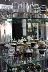 Glass of wine bottles on shelf at bar