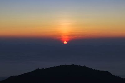 Scenic view of silhouette landscape against romantic sky at sunset