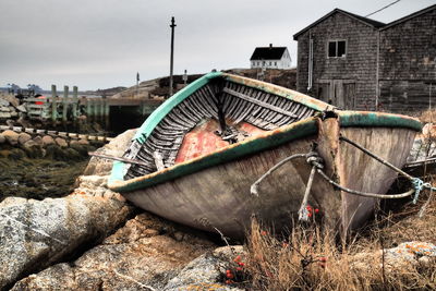 Abandoned boat against sky